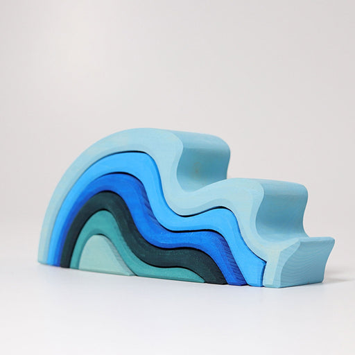 grimm's water waves medium wood stacking blocks colours from largest to smallest: light blue, sky blue, royal blue, navy, turquoise, pale turquoise