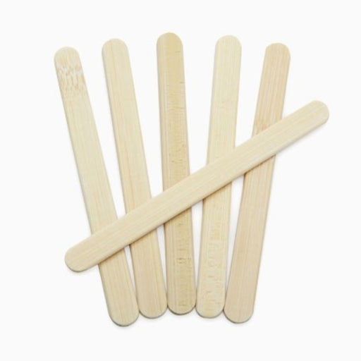 6 reuseable bamboo popsicle sticks laid on white background